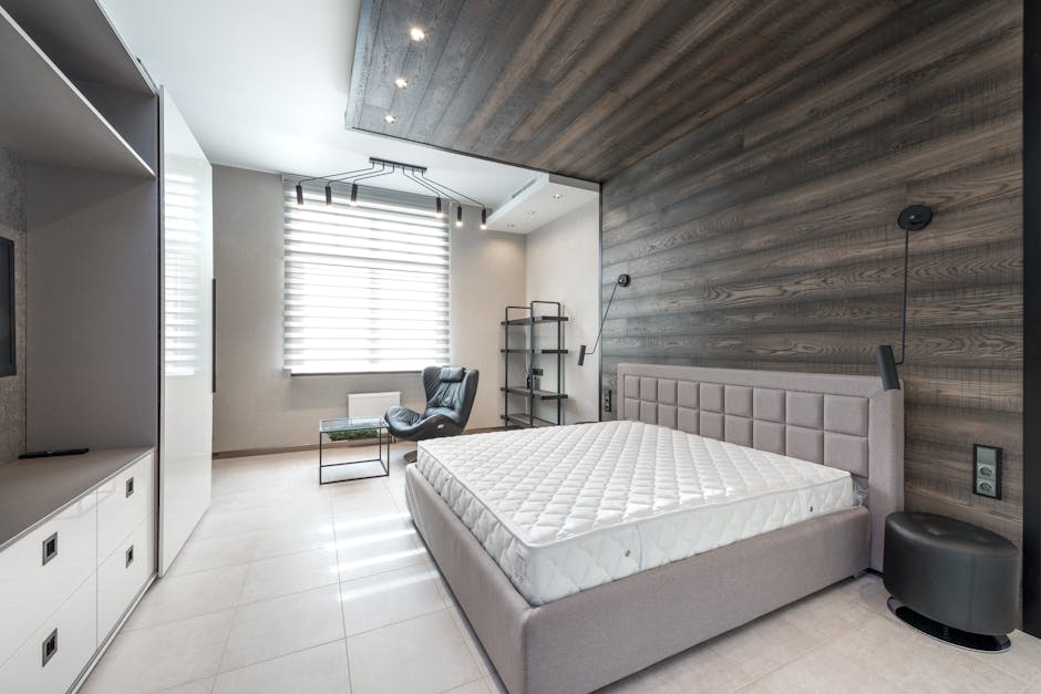 A hotel guestroom with a custom-designed headboard and a high-quality hospitality mattress, implying superior comfort.