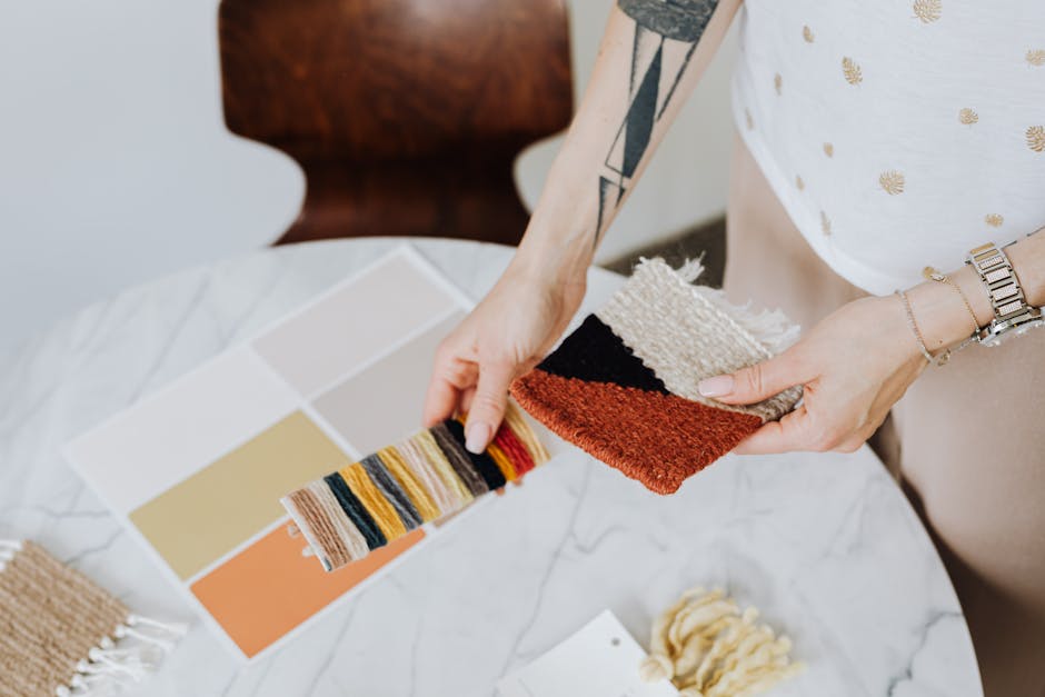 Close-up of fabric samples with color swatches for interior design.