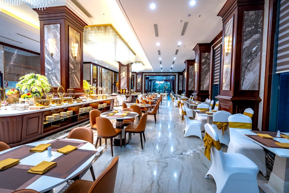 Elegant hotel dining room with luxurious decor and seating arrangement.