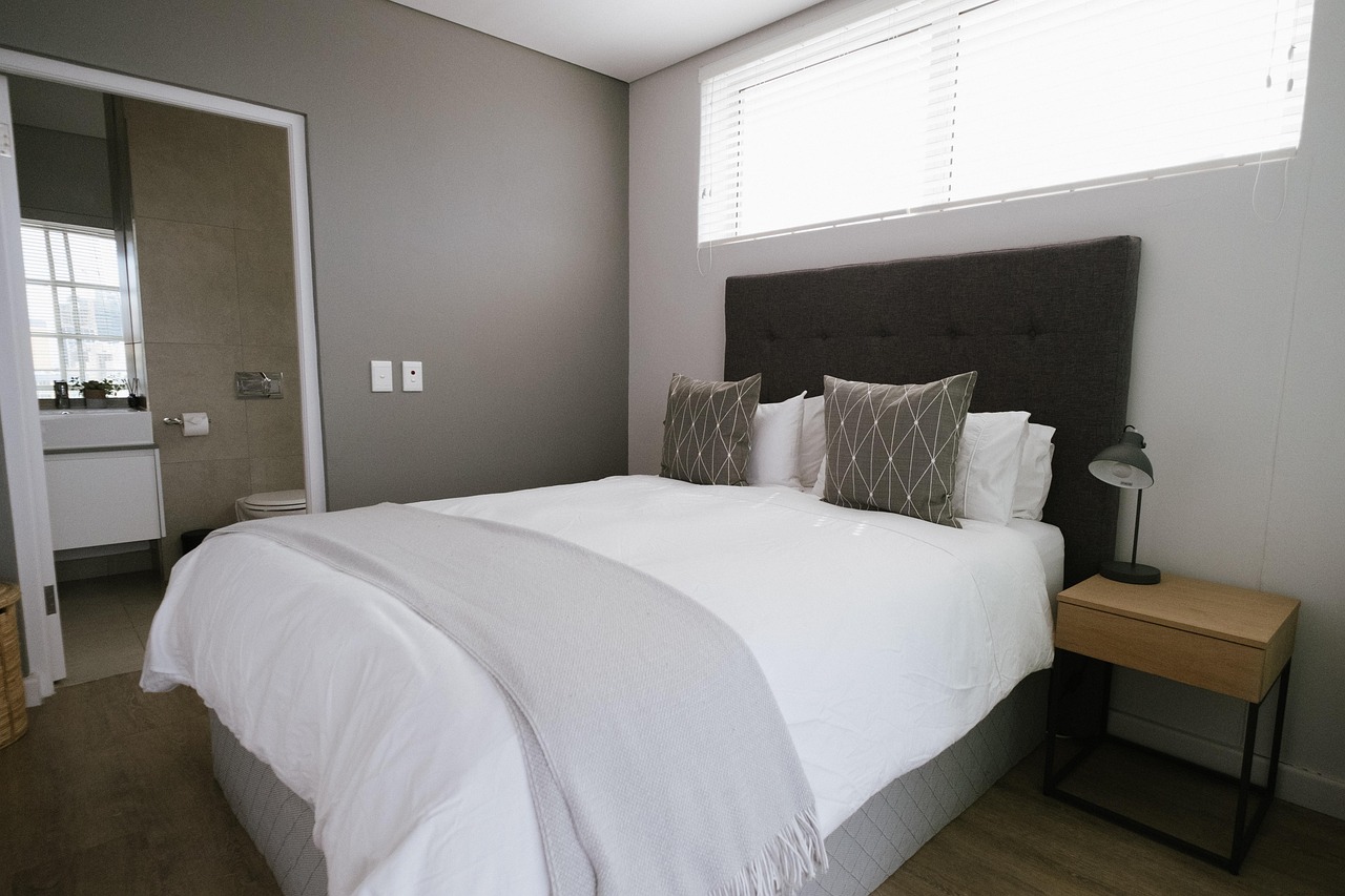 interior designer examining material samples for custom hotel bed upholstery