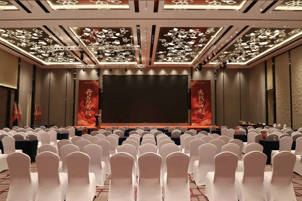 Large theater conference hall with stage at Courtyard Changchun Poly