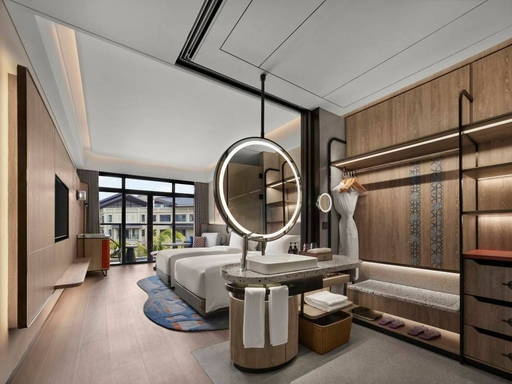 Dhawa Beihai Weizhou Island guestroom vanity and lounge area — furniture by Zhobai