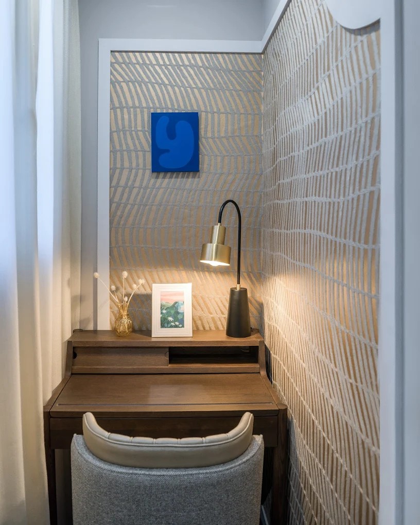 Blue accent wall room desk nook at Hotel Camille Paris
