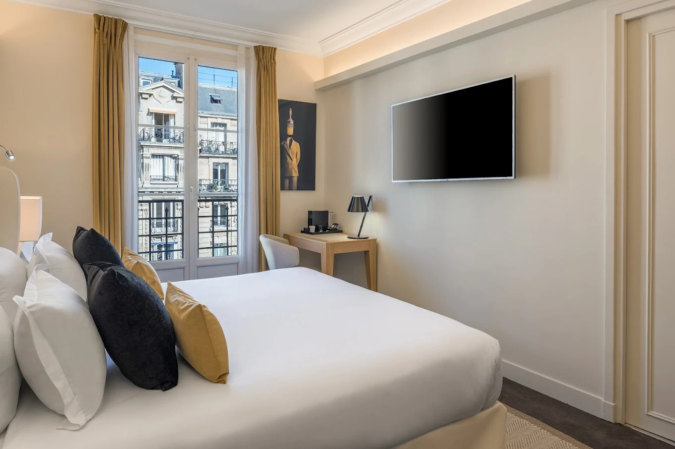 Deluxe King bedroom with city view at Hotel Camille Paris