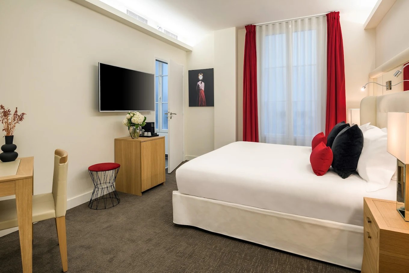 Economy King room with warm terracotta curtain decor at Hotel Camille Paris
