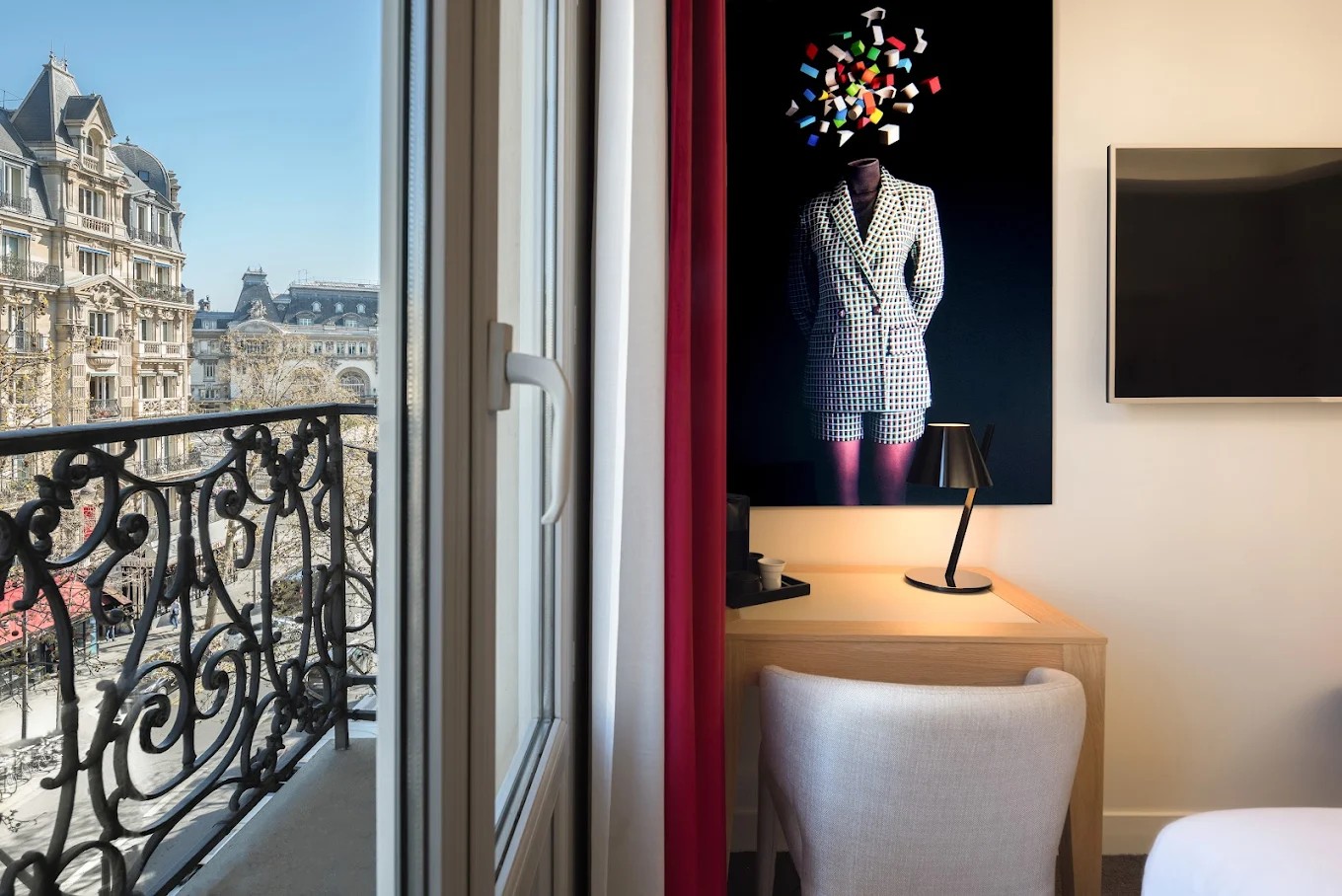 High-floor bedroom with Paris street view at Hotel Camille Paris