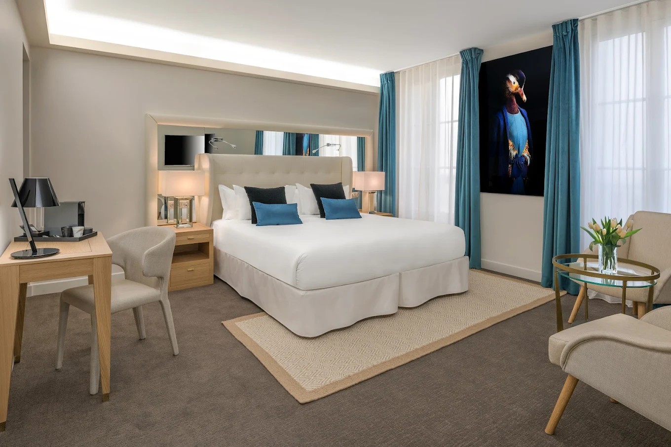 King room with blue curtain and city view at Hotel Camille Paris