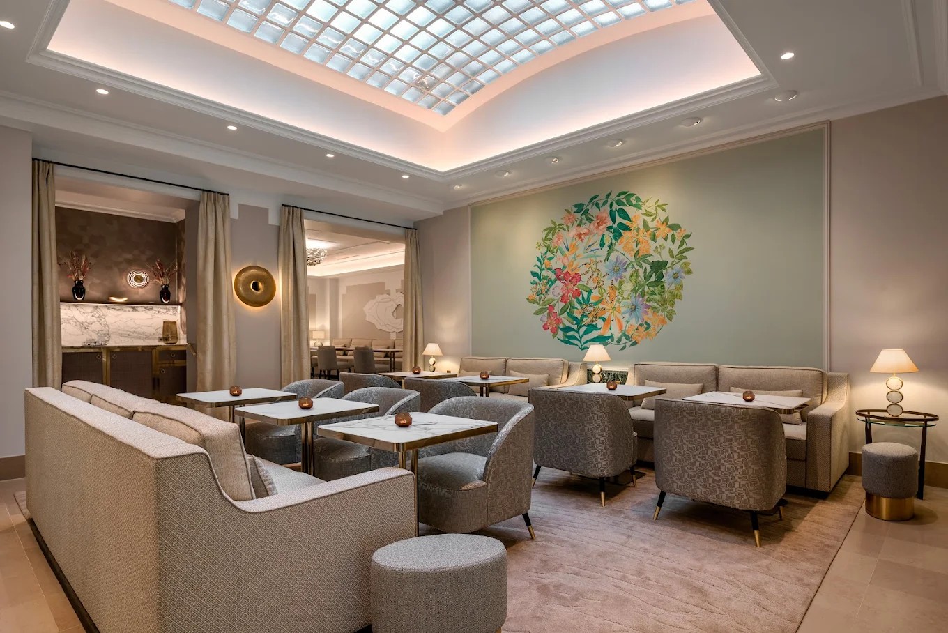 Central art lounge area in Hotel Camille Paris lobby