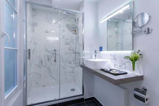 Luxury marble shower bathroom at Hotel Camille Paris
