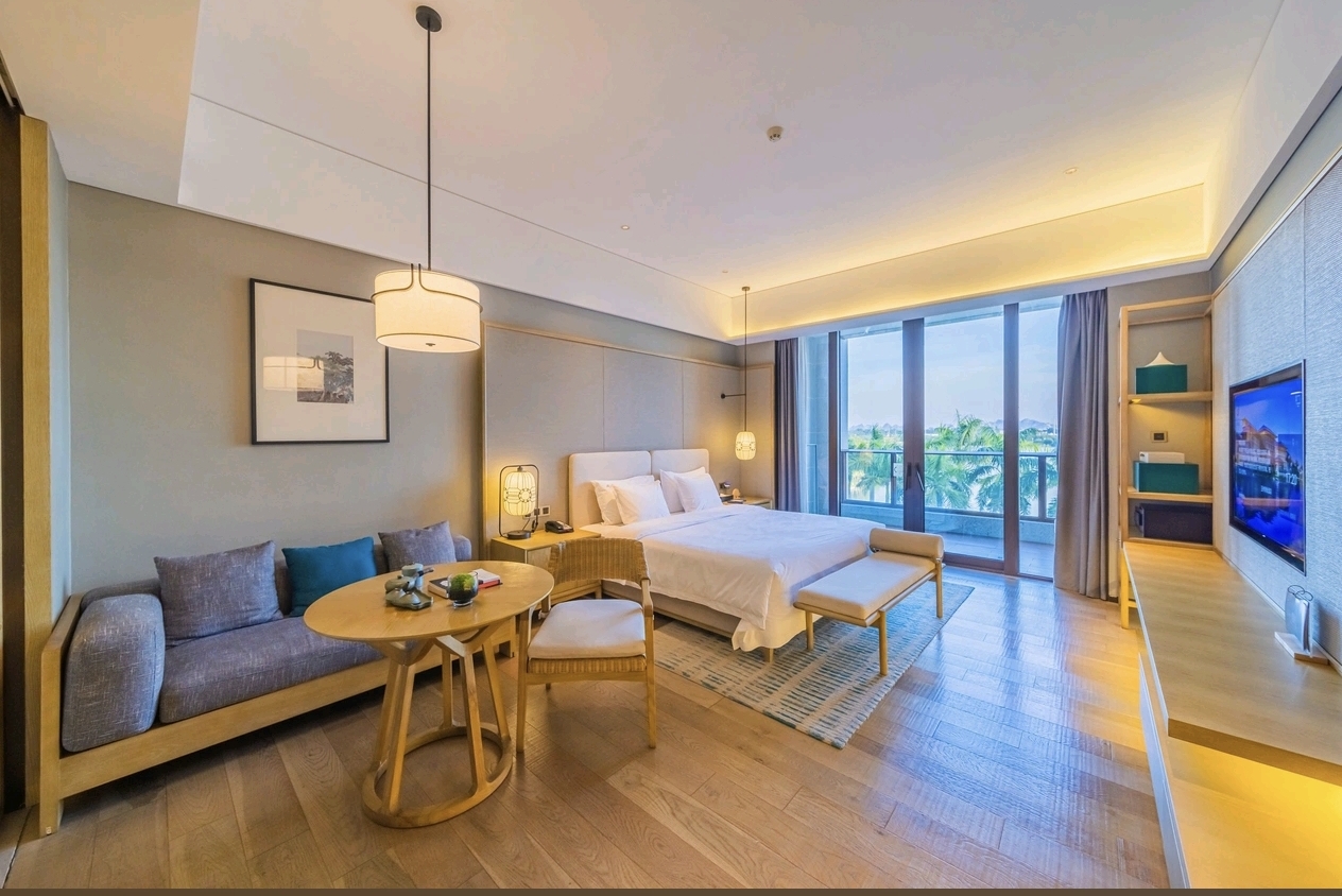 Jolie Vue Hotel Yulin deluxe suite living and bedroom — furniture by Zhobai