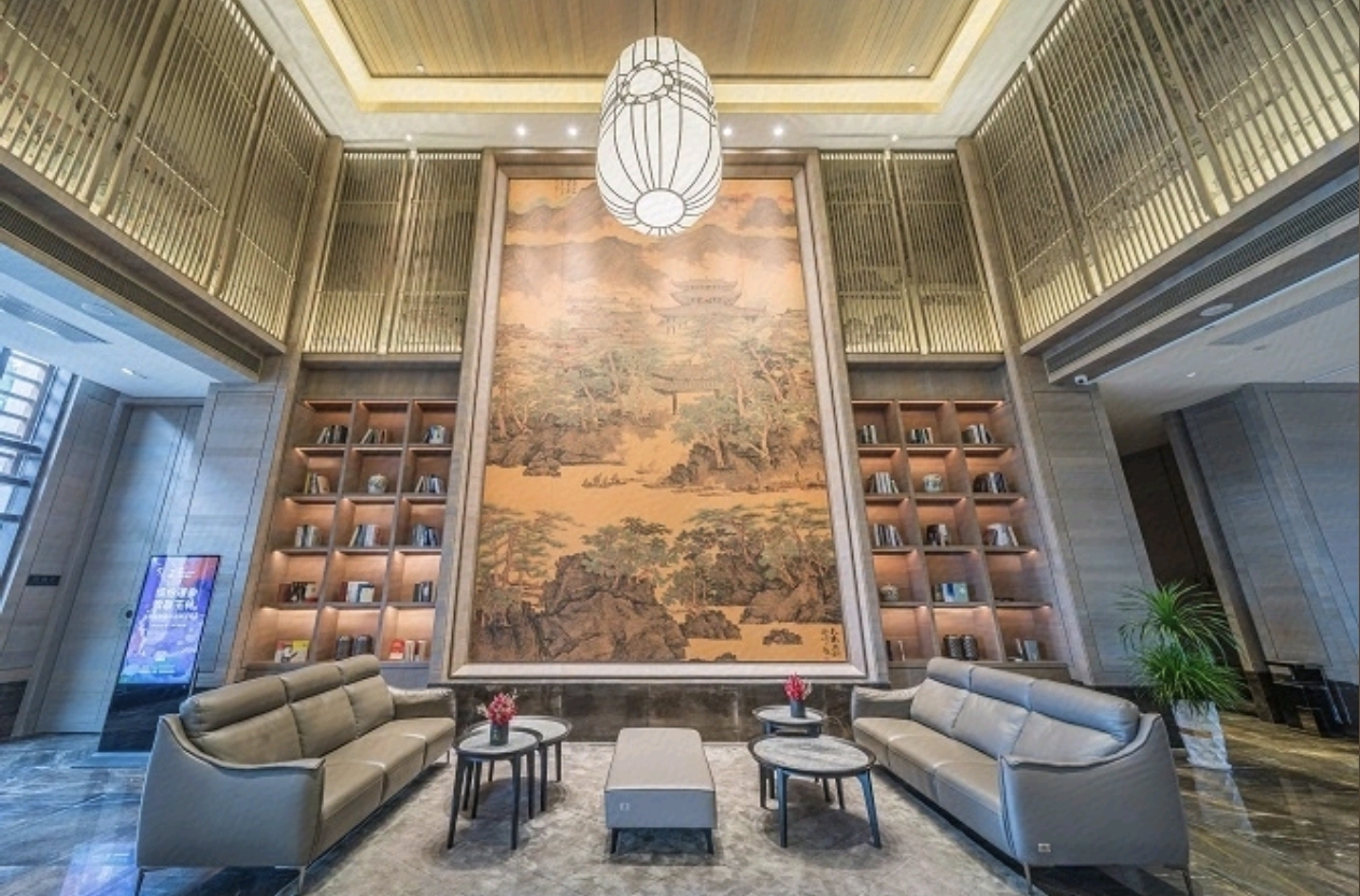 Jolie Vue Hotel Yulin lobby mural wall reception — cultural design elements