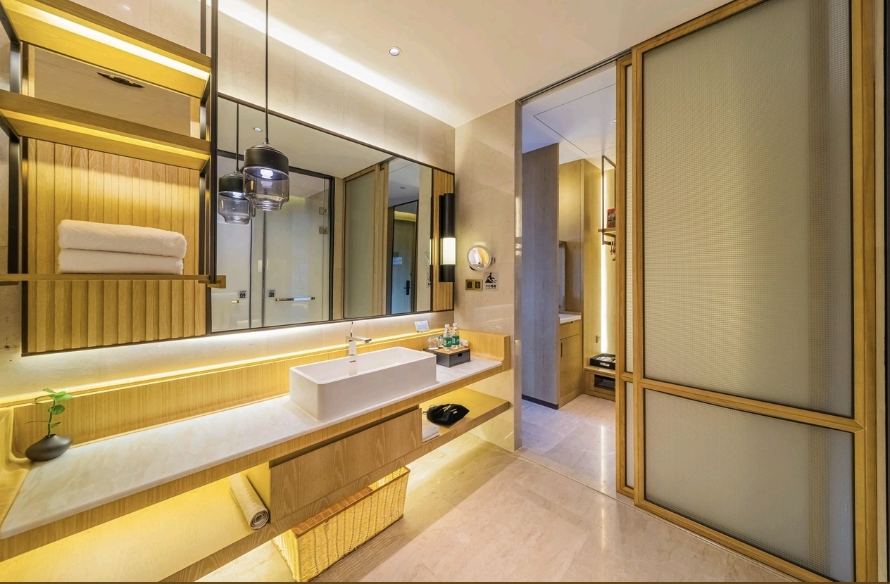 Jolie Vue Hotel Yulin room washstand and vanity area — bathroom furniture by Zhobai
