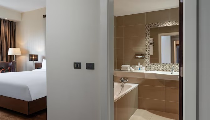 Radisson Blu Addis Ababa combined bedroom and bathroom — integrated design by Zhobai