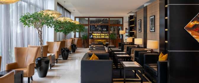 Radisson Blu Addis Ababa long corridor lobby bar — hotel bar furniture by Zhobai