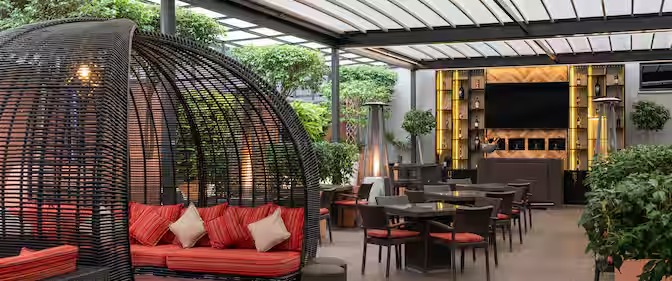 Radisson Blu Addis Ababa open-air courtyard lounge — outdoor seating by Zhobai