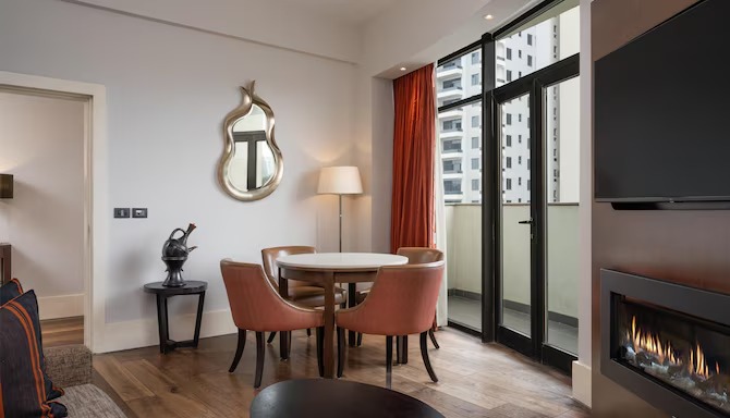 Radisson Blu Addis Ababa room dining nook with fireplace — suite furniture by Zhobai