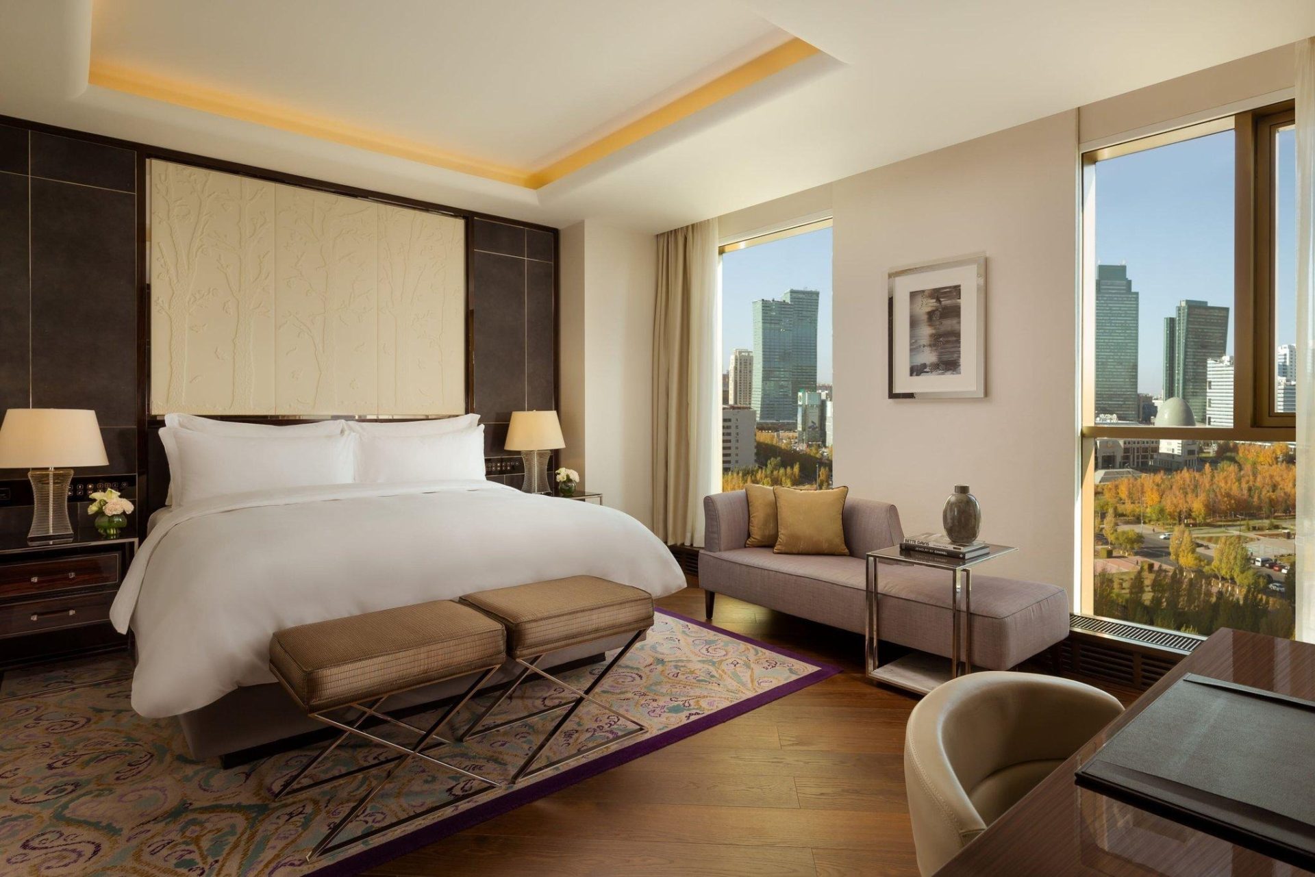 The Ritz-Carlton Almaty city view suite living and bedroom — suite furniture by Zhobai