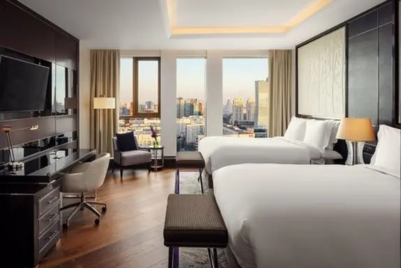 The Ritz-Carlton Almaty deluxe king room city view — hotel furniture by Zhobai