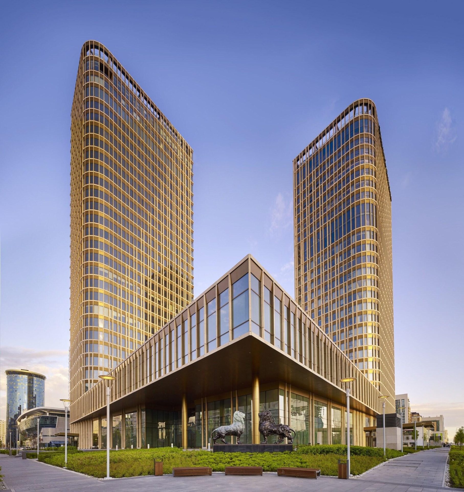 The Ritz-Carlton Almaty twin tower exterior building — hotel furniture by Zhobai