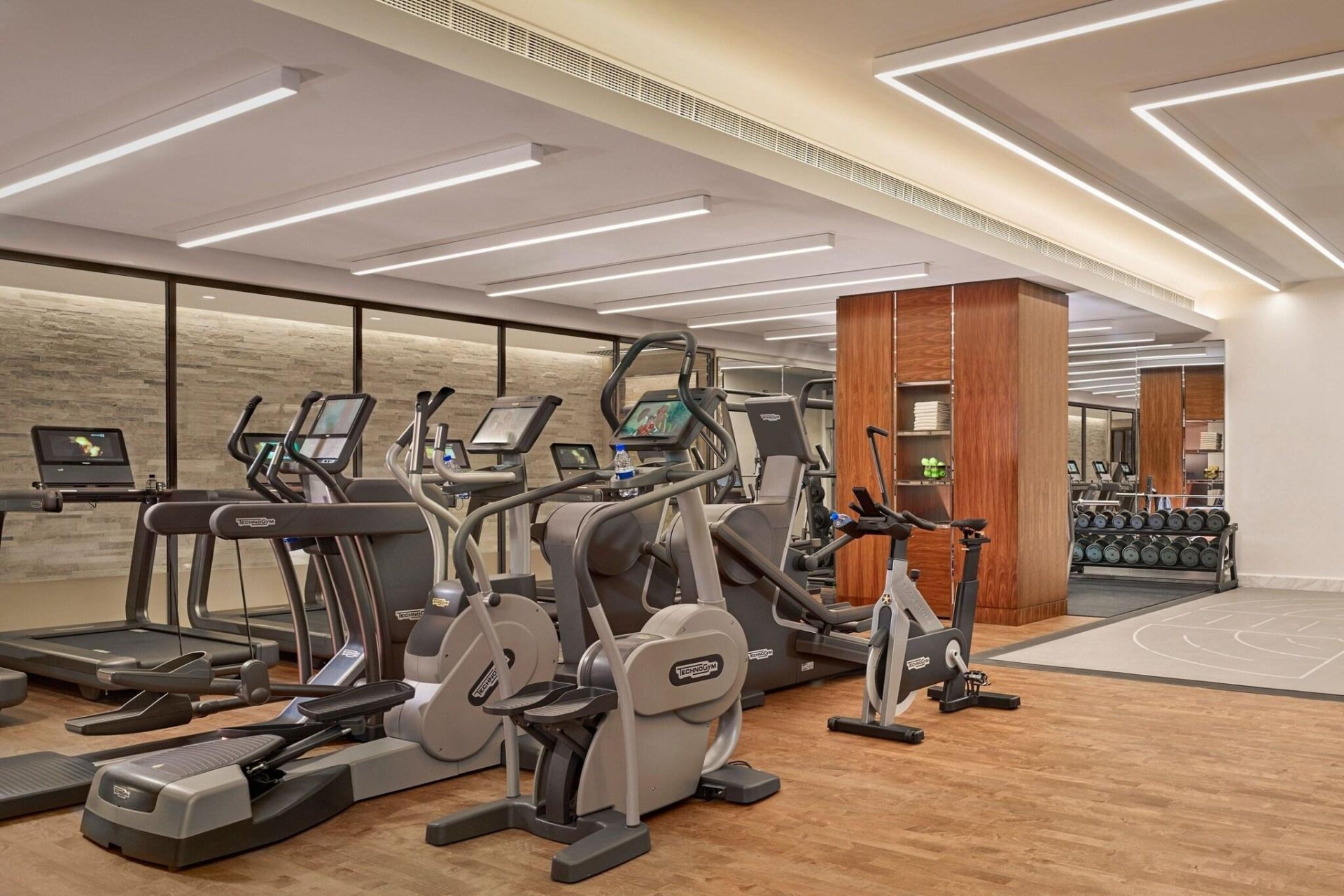 The Ritz-Carlton Almaty indoor fitness gym centre — hotel wellness furniture by Zhobai