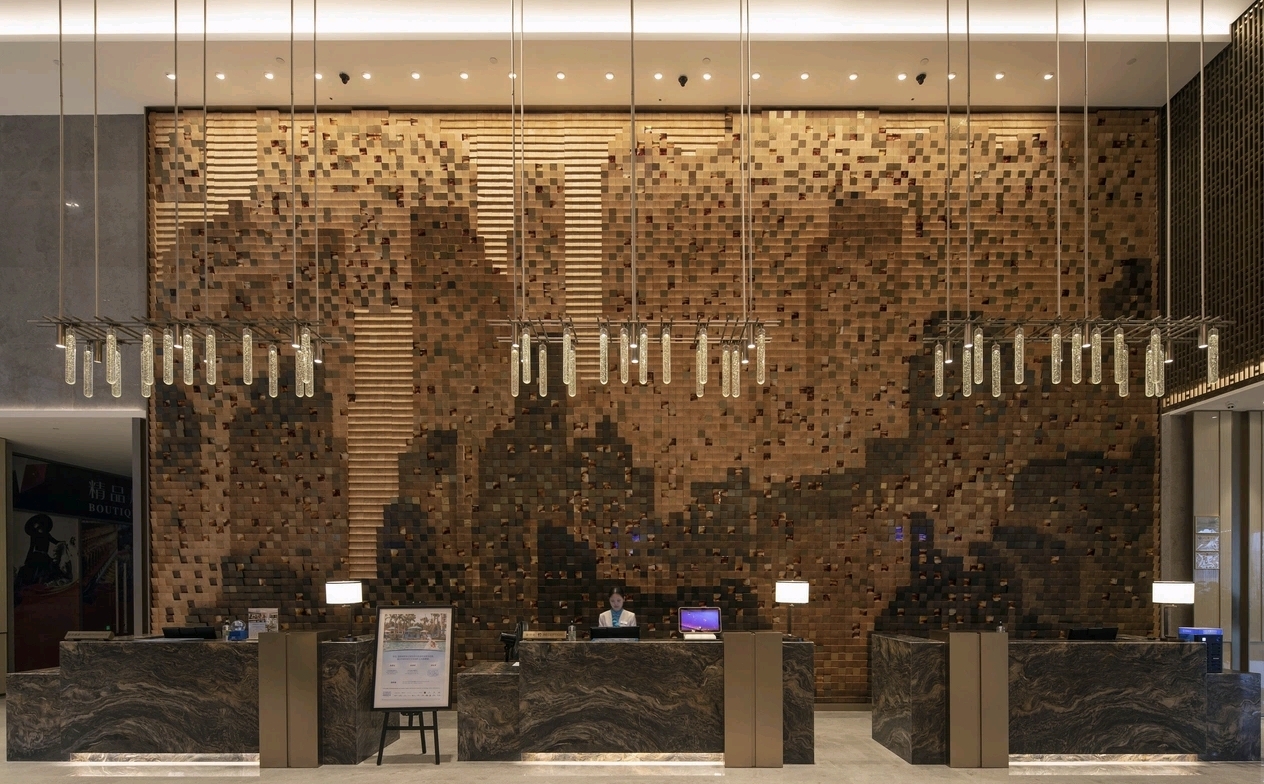 Wyndham Baise Resort lobby carved wall reception — cultural design elements by Zhobai