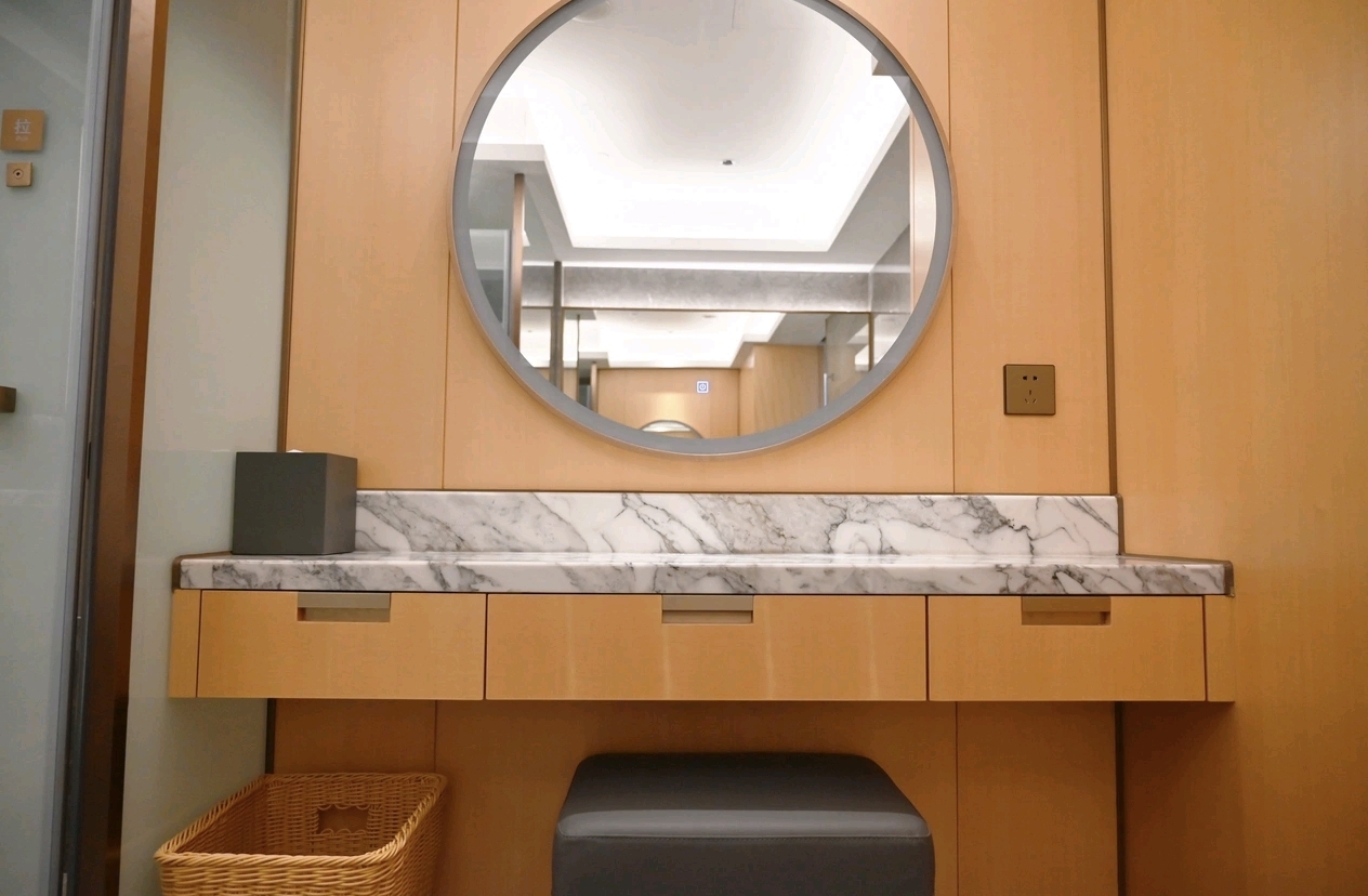 Room wood vanity and wall detail at Wyndham Grand Zhaoqing
