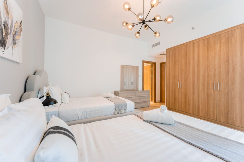 A detailed view inside a custom modular hotel closet showing organized shelving, hanging space, and drawers, highlighting durable commercial closet systems.