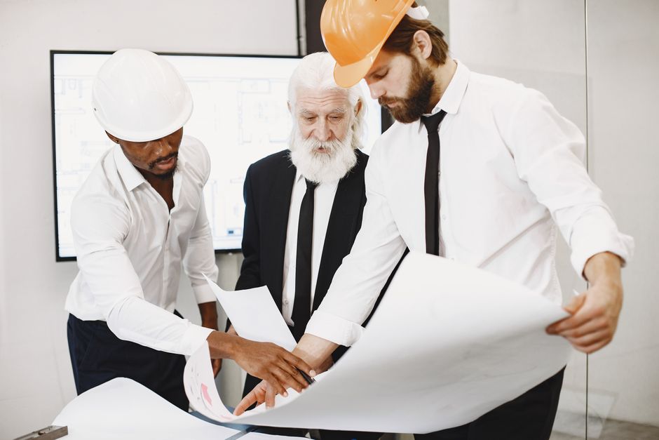 A large, professional furniture manufacturing facility with specialized machinery, showcasing the production capacity for custom hotel FF&E procurement.