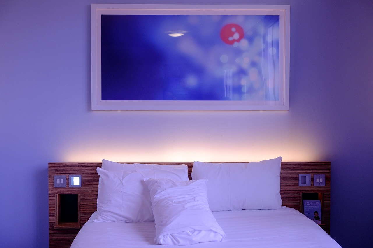 elegant hotel suite with bespoke upholstered sofa and sophisticated lighting