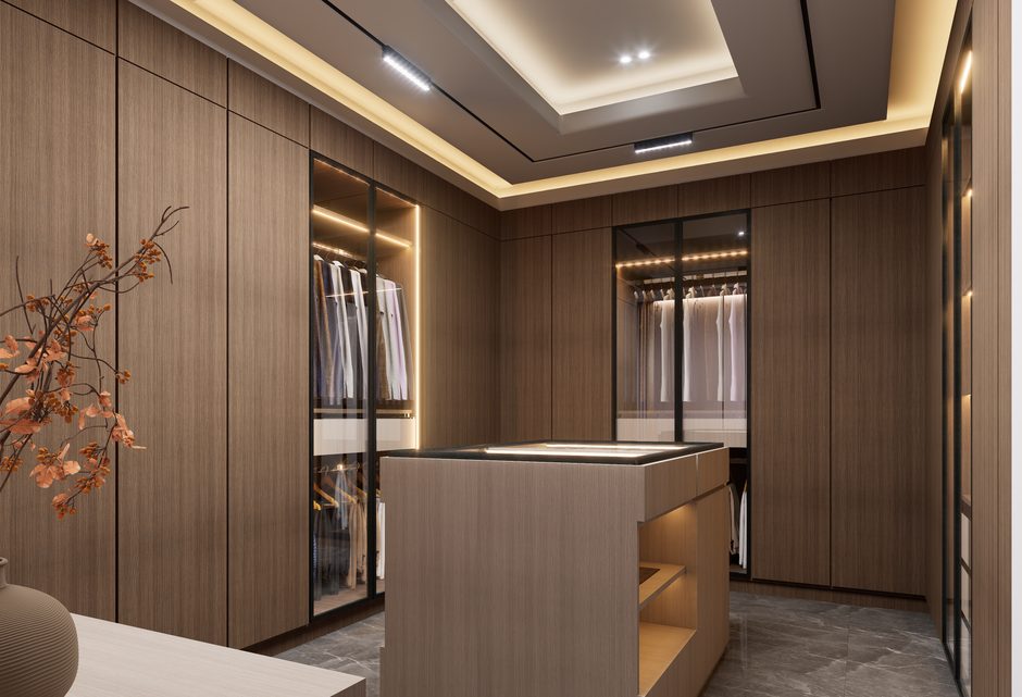 Hotel guest unpacking luggage into a well-designed hotel wardrobe price with sliding doors, emphasizing ease of use and space-saving hotel wardrobe design.