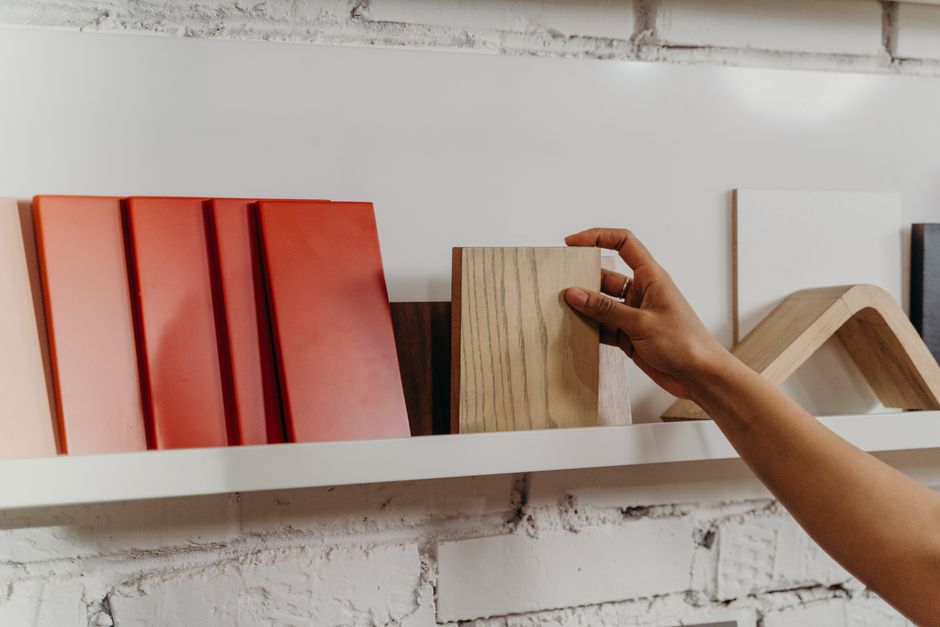 HPL laminate vs wood veneer surface finish samples on hotel furniture for material cost evaluation