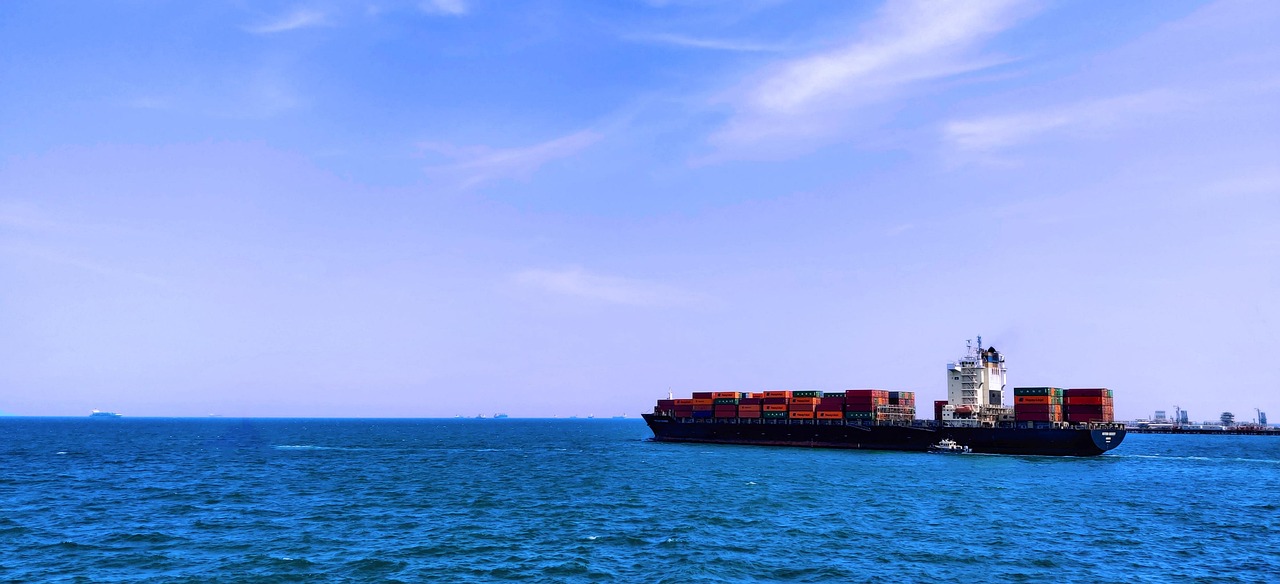 Shipping containers at Chinese port with hotel furniture for export