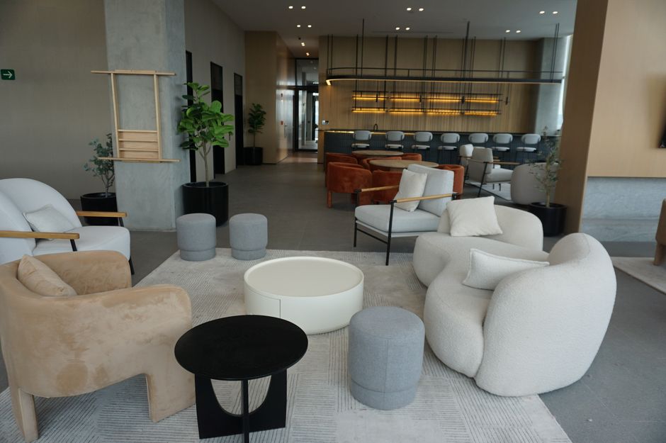Sophisticated lounge featuring chic modern furniture, ideal for upscale interiors.