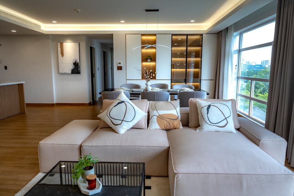 Stylish and spacious living room with a contemporary design, featuring plush seating and chic accents.