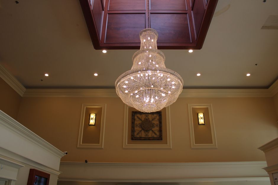 A grand chandelier illuminates a sophisticated interior with classic decor in Berlin, Ohio.