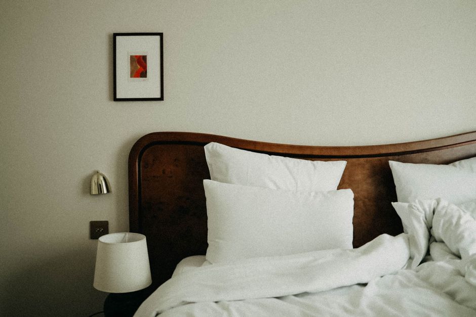 Chic bedroom featuring modern decor with plush pillows and a stylish headboard.