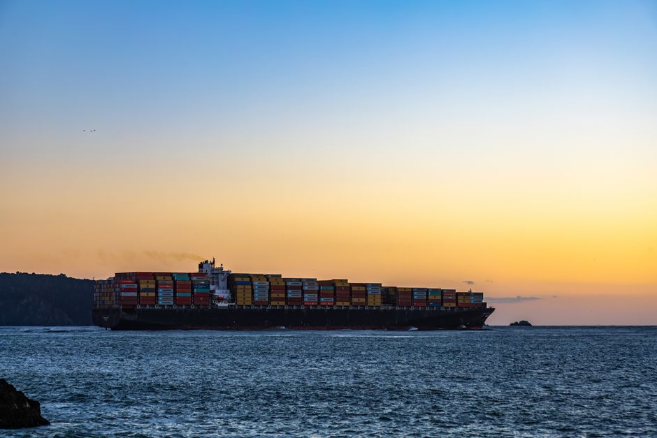 Container ship transiting Strait of Hormuz chokepoint with oil tankers
