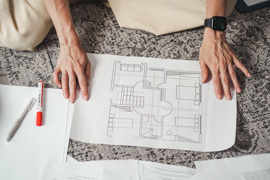 Hotel construction blueprint with valuation model overlaid