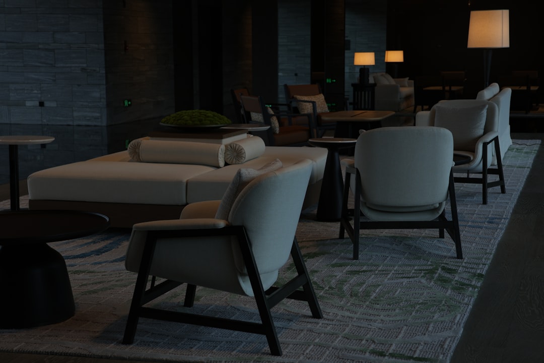 Modern lounge area with comfortable seating and lamps.