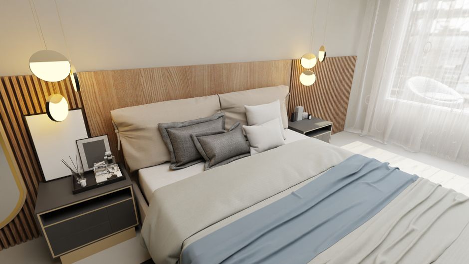Stylish bedroom featuring modern decor with elegant lighting, cushions, and wooden headboard.
